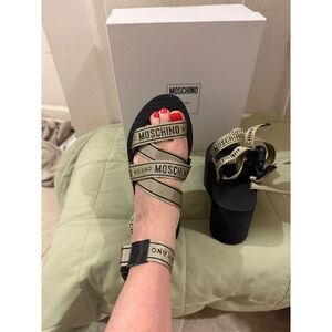 Moschino Logo Tape multi-strap sandals in black and gold
